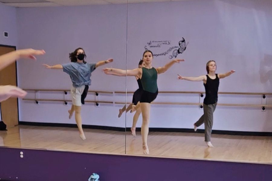 Teen dancers practicing teamwork and confidence in Michigan dance studio